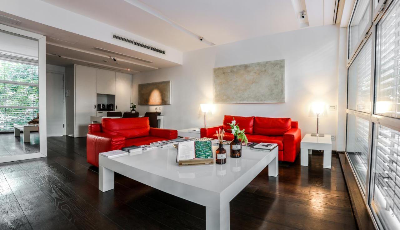 마그나 파스 이 호텔 어 퍼퓸 밀라노 외부 사진 A living room in a serviced apartment in Vienna, Austria